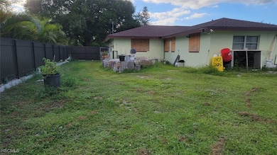 Rear view of house featuring a patio, a fenced backyard, roof with shingles, and stucco siding