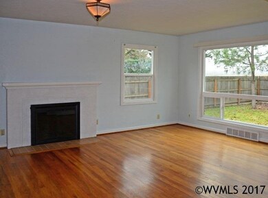 Hardwood floors, Fireplace and lots of windows