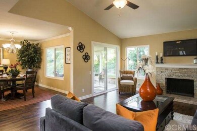 Living room adjacent to dining room and patio