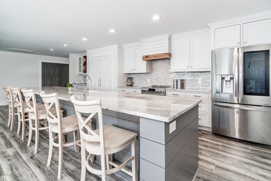 Large, custom kitchen w/ island seating