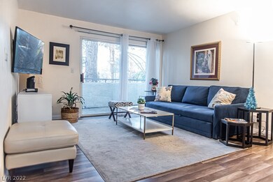 Living/family room with a balcony and a view of th