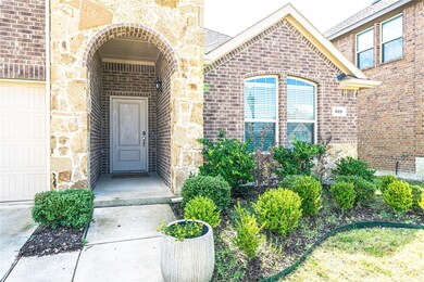 Doorway to property featuring a garage