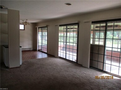 The formal dining area unites with the living room