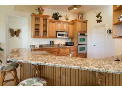 Kitchen. Gourmet Kitchn features granite, double o