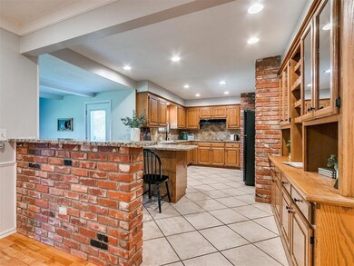 Kitchen featuring light stone counters, black frid