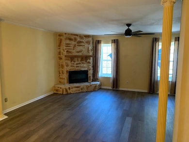 Unfurnished living room with ornate columns, ceili