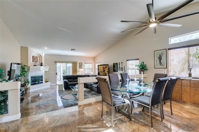 Dining room with ceiling fan, light marble finish