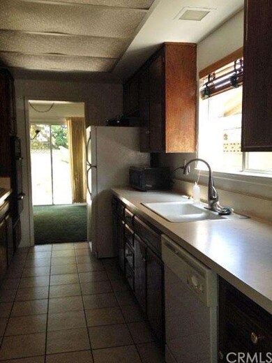 A view of the large galley style kitchen as you en