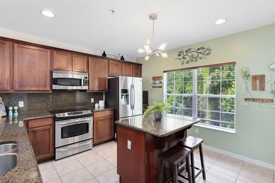 Lovely kitchen with large wood cabinets & an island