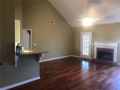 Unfurnished living room featuring dark wood-style 