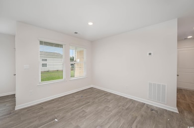 Spare room with light hardwood / wood-style floors