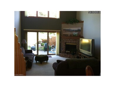 The cozy living room features a gas fireplace and 