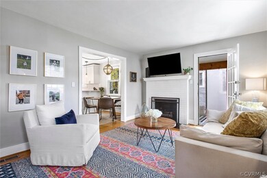 Hardwood floors and lovely flow into the kitchen and sunroom.