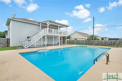 The 30' x 44' in-ground pool has cool decking surr
