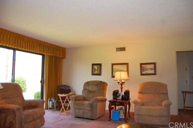 Spacious living room with sliding glass door leadi