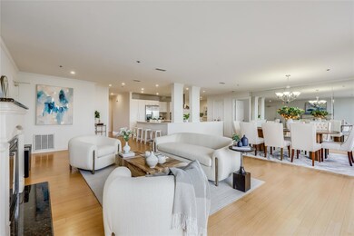 Living area featuring visible vents, a fireplace 
