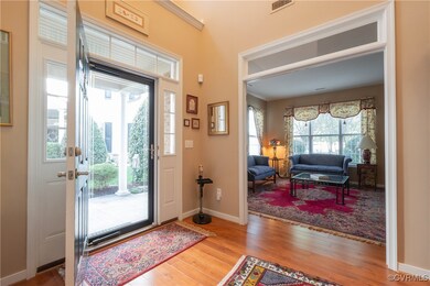 Foyer with light hardwood / wood-style floors