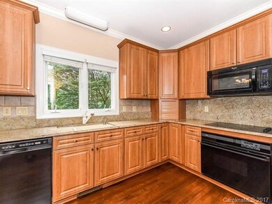 Granite counter tops with backsplash, lots of cabi