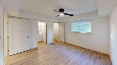 Unfurnished bedroom featuring light wood-style flo