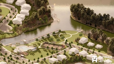 Aerial overview of property's location with a nearby body of water