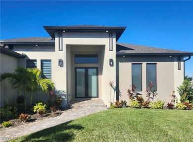 Entrance to property with french doors and a yard