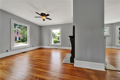 Large, open living room with gorgeous original woo