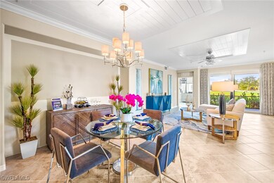 Dining area with light tile patterned floors, a no