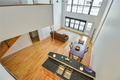 The kitchen with counter eating has all GE Profile appliances which remain with the property.