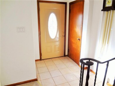 Welcome guests thru the ceramic tile entry - coat 