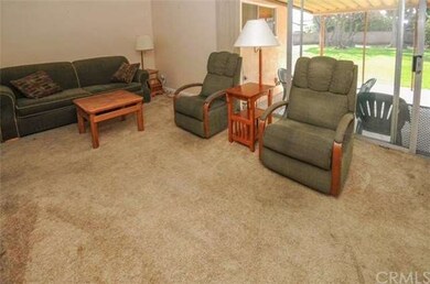 Living room with slider opening to rear yard