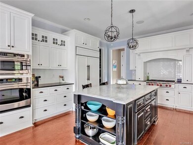 Another view of the kitchen ~ Walk-in pantry and plenty of drawers & cabinets