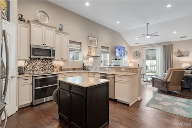 Kitchen with open floor plan, stainless steel appl