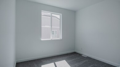 Unfurnished room with dark carpet and baseboards