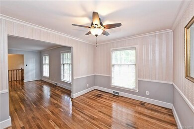 Dining Room complete with crown molding and chair 