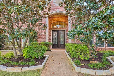 Doorway to property featuring iron french doors.