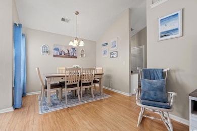Dining area with vaulted ceiling, an inviting chan
