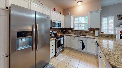 Beautiful kitchen with granite counter tops, stain