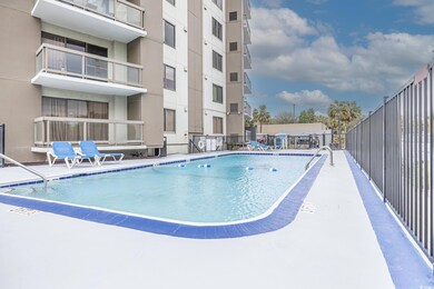Community pool featuring fence