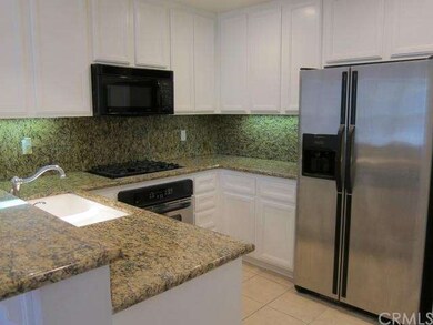Gourmet kitchen with granite and stainless steel a