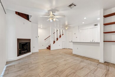 Cozy living room featuring a wood-burning fireplac