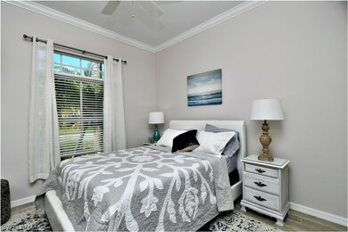 Guest bedroom with updated tile flooring and crown molding