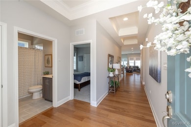 Hall featuring engineered hardwood floors, tray ce