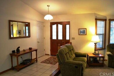 The formal entry area is welcoming, with coat clos