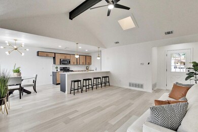Living area featuring ceiling fan with notable ch