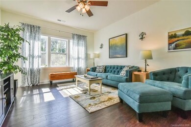 Spacious, light-filled living room with new lamina