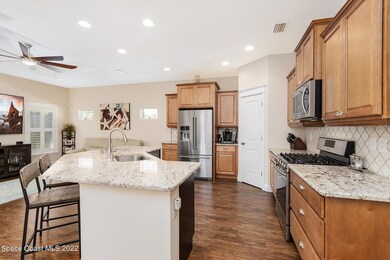 Kitchen w/ living room in beyond