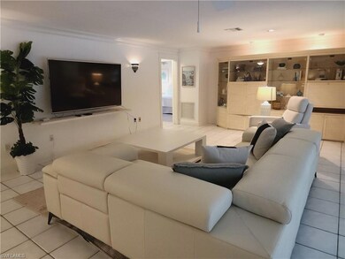 Living room featuring light tile patterned floors,