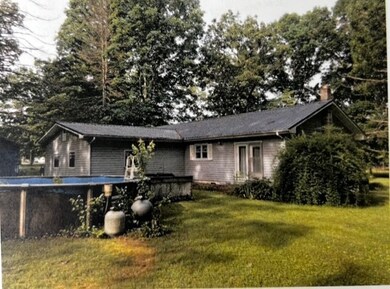 Back view with pool, condition questionable..