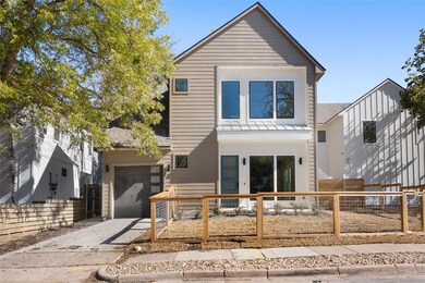 View of front of property featuring a fenced front yard, concrete driveway - carport to be enclosed.
