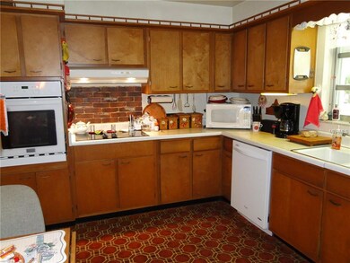 Kitchen overlook front courtyard.  Eat in area in kitchen.